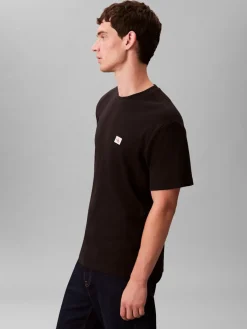 Calvin Klein Jeans miesten t-paita SS Waffle Badge Crewnk Tee, musta